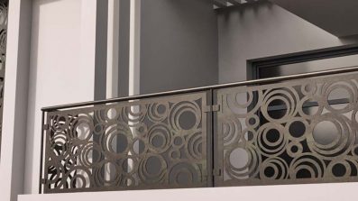 Vista exterior de una vivienda con decoración de balcón y fachada en círculos